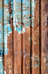 pattern rusty metal surface with remnants of blue paint