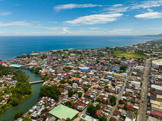 Iligan City: Highway between commercial buildings. Northern Mindanao, Philippines.