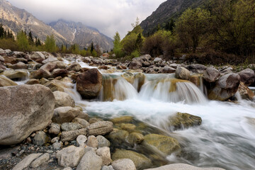 Waterfall in the mountains. Clean water of a mountain river. Amazing nature scenery in mountains...