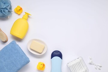 Different baby bath accessories and cosmetic products on white background, flat lay. Space for text