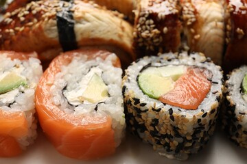 Set of delicious sushi rolls, closeup view