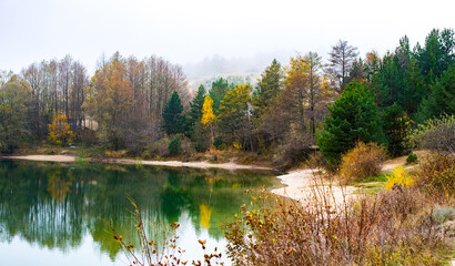 Bansko Bulgaria, autumn panorama in the fog water of the lake