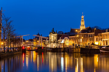 Scenic summer view of the Old Town architecture and Spaarne canal embankment in Haarlem, Netherlands