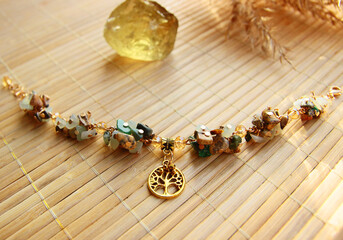 Delicate vintage bracelet made of a mix of natural stones jasper, jade with a golden tree of life...