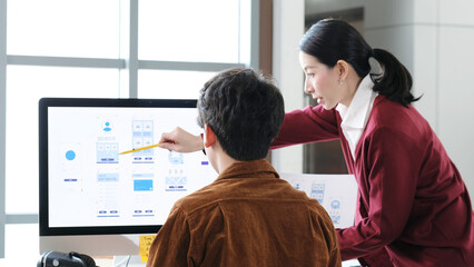 Website designer, Creative planning phone app development template layout framework wireframe design, Young asian woman and man UX designer working on smartphone application at office
