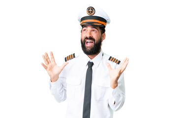 Airplane caucasian pilot man over isolated chroma key background with surprise facial expression