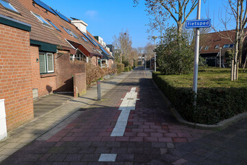 Fototapeta na wymiar Biking path along the Zuidplas districht in Nieuwerkerk aan den IJssel
