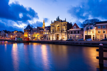 Fototapeta na wymiar Night View of Harlem Sight on Spaarne River On The Background At twilight