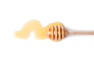 Wooden dipper and fresh honey on white background, top view