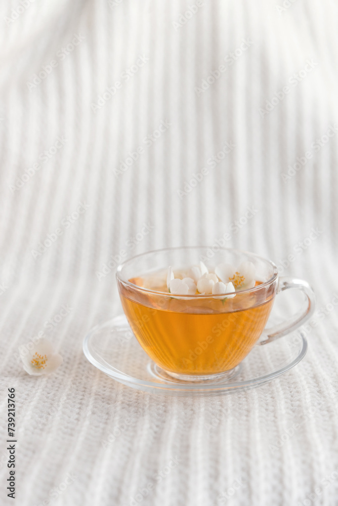 Sticker Jasmine fragrant herbal tea on a light pastel background. Cup of tea. Antioxidant, dietary tea for weight loss and blood pressure.	