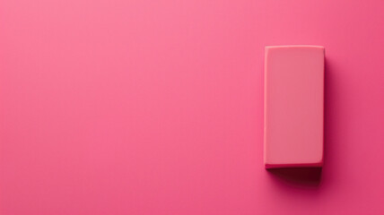 Eraser on a vibrant pink background - obrazy, fototapety, plakaty