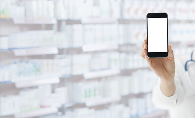 Pharmacist showing a smartphone at the pharmacy