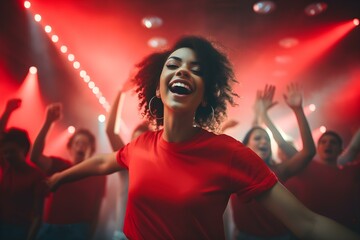 Energetic young woman wearing a chic red tshirt grooving with a vibrant crowd under neon lights in a nightclub. Concept Nightclub Scene, Neon Lights, Energetic Dancing, Chic Fashion, Vibrant Crowd