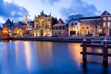 Fototapeta na wymiar Historic houses at the Nieuwe Gracht canal in Haarlem Netherlands