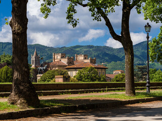 View of San Concordio old district and Pisan Mountain Range from Lucca city walls public park - 739223555