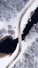 Winter road over open river