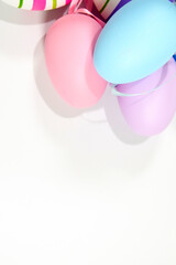 Colorful Easter Eggs on white background copy space stock photo