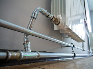 Fragment of a heating system using stainless steel pipes