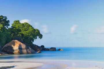 30 seconds long exposure of beautiful white sandy beach, granite rock boulders and turquoise water,...