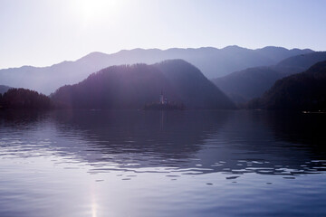 fog on the Bled lake with island on background