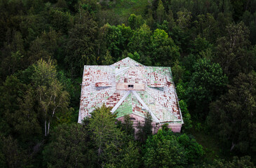 dron picture of an old abandoned stone house in the forest, estonia