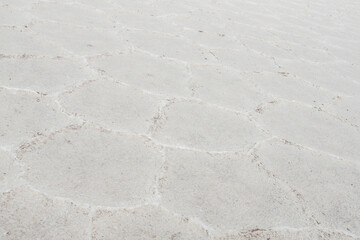 close up of the salt flats, Salinas Grandes in Salta, Argentina. Creating polygon shapes. Nature in its purest state.