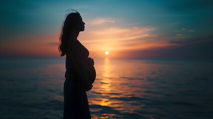 Expectant Mother Silhouette at Ocean Sunset - Tranquil Maternity Image