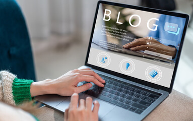 Social media online content, freelance worker, working online, content creator, woman using laptop, woman reading blog online on computer at home.