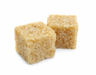 Two brown sugar cubes isolated on white