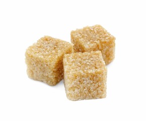 Three brown sugar cubes isolated on white