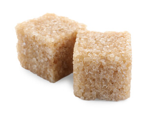 Two brown sugar cubes isolated on white