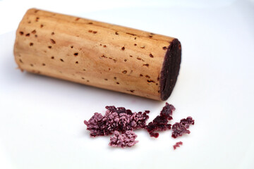 red wine cork and dry crystallized wine sediment on a white background 