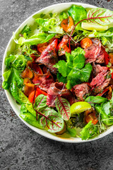 Roastbeef salad with vegetables on plate