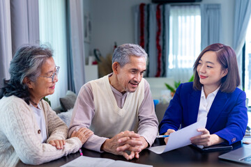 Asian senior couple get advice from lawyer on legal financial contract and insurance health care...