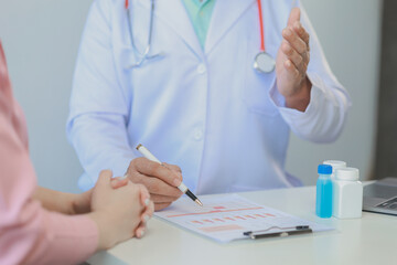 The doctor is giving advice and recommending health care methods to the patient in a friendly way, The doctor and the patient are discussing the process of future treatment.