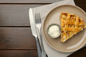 Piece of tasty homemade quince pie served on wooden table, flat lay. Space for text