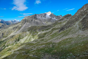 Fototapeta na wymiar Panoramic view of majestic mountain peak of Gamskarlspitz in High Tauern National Park, Carinthia, Austria. Idyllic hiking trail in Austrian Alps. Hike paradise Mallnitz. Wanderlust in summer. Escape