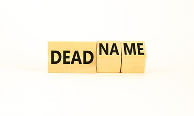 Deadname or name symbol. Concept words Deadname or Name on beautiful wooden blocks. Beautiful white table white background. Business, deadname or name concept. Copy space.