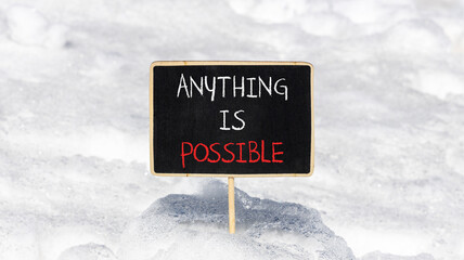Anything is possible symbol. Concept words Anything is possible on beautiful black chalk blackboard. Beautiful white snow background. Business anything possible concept. Copy space.