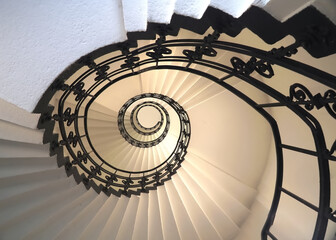 Spiral staircase still life with black ornament railing top view