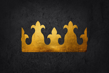 Golden crown from a king with dark background.