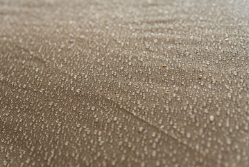 Drops of rain, water on a waterproof fabric close-up.