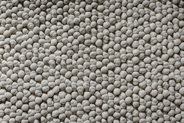 Carpet or white beach towel texture background in grey color made of wool or synthetic fibers,...