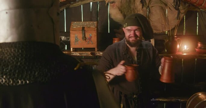 Innkeeper serves ale to knight in tavern. Smiling dwarf bartender shows dont worry gesture and gives drink to noble lord in public house. Fairy tale scene