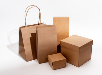 Kraft paper and cardboard packages mockups. Carton packs arrangement