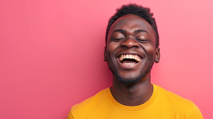 Obraz premium Joyful East African Man, Isolated on Solid Background - Copy Space Included