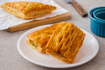 Baked puff pastry on white plate
