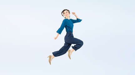 Fototapeta na wymiar Full body photo of a white woman jumping. (We also sell PNGs that are cropped and have transparent background. Please search for 