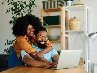 laptop man woman computer technology home couple young together happy happiness smiling...