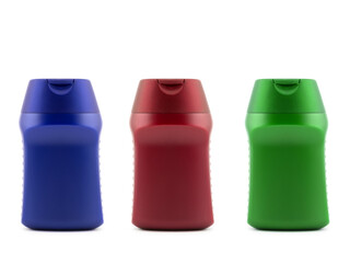 set of multicolored plastic cosmetic bottles, side view closeup on white background